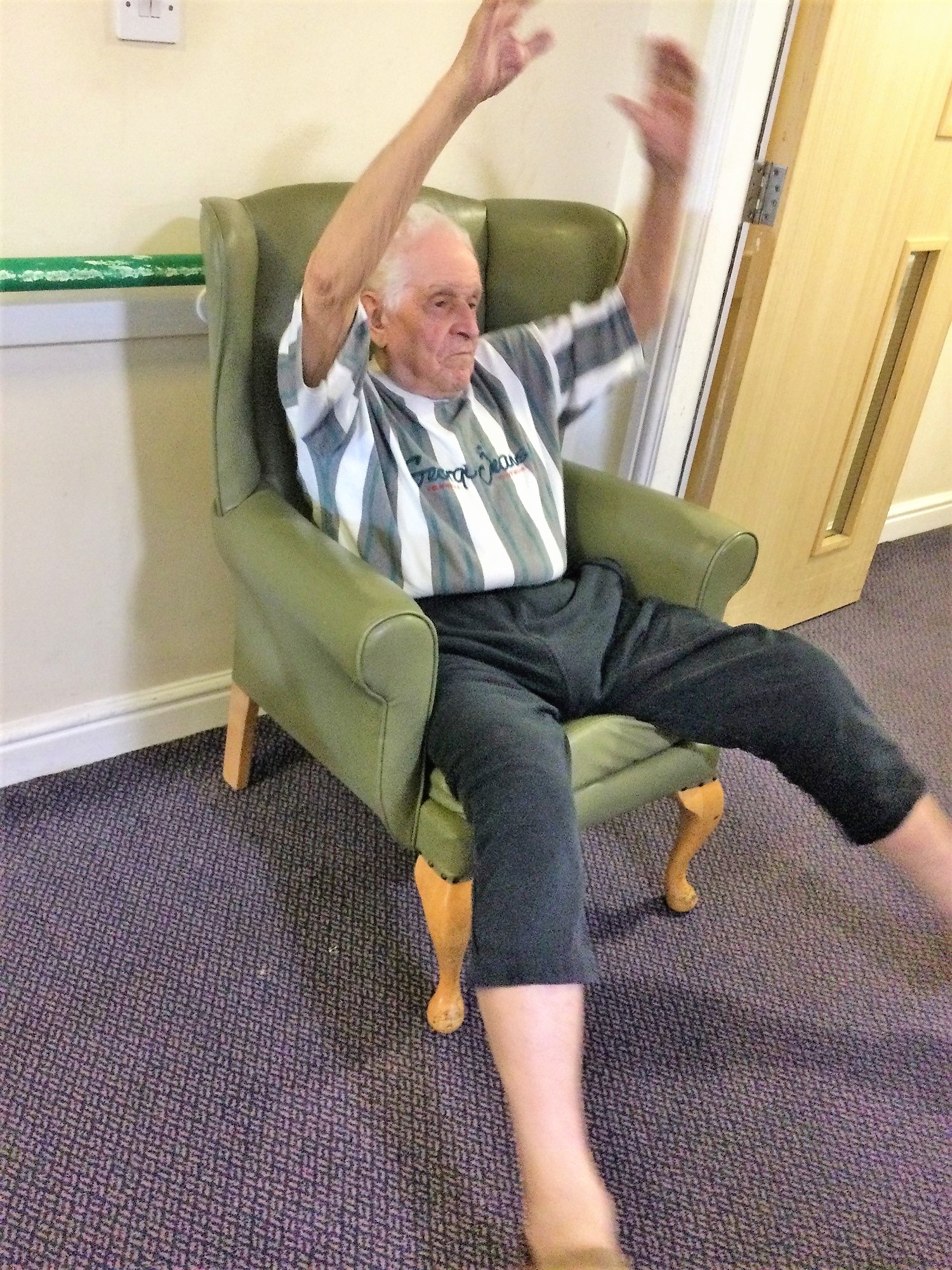 man doing armchair exercise